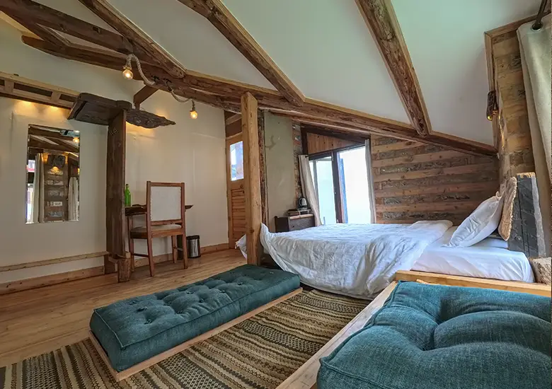 bedroom-and-seating-area-in-spring-green-attic-room-naggar