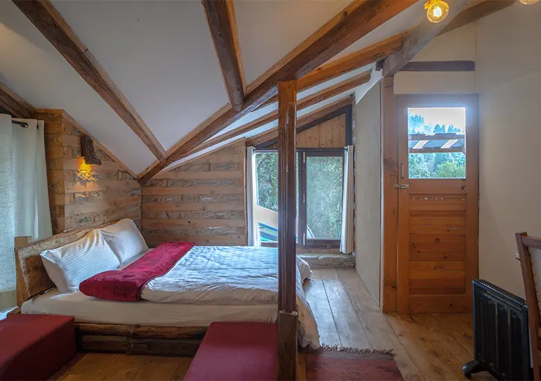 bedroom-with-view-of-autumn-maroon-attic-room-naggar